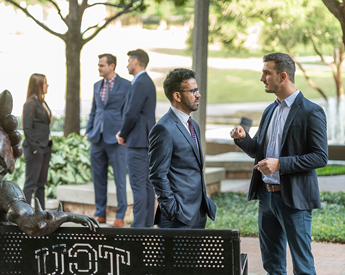 Real estate students networking on campus