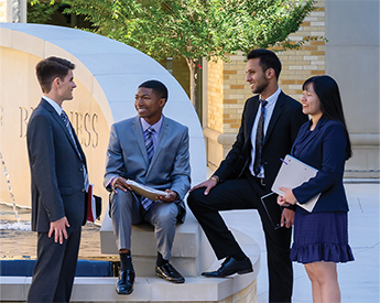 TCU Neeley School of Business students gathered by fountain