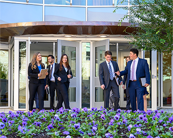 TCU Neeley School of Business students walking together on campus