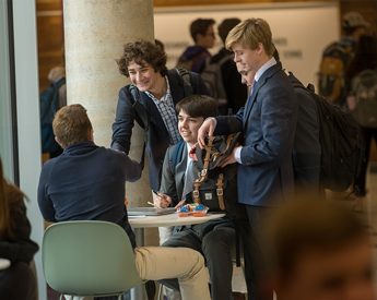 Students networking and being introduced to industry professional