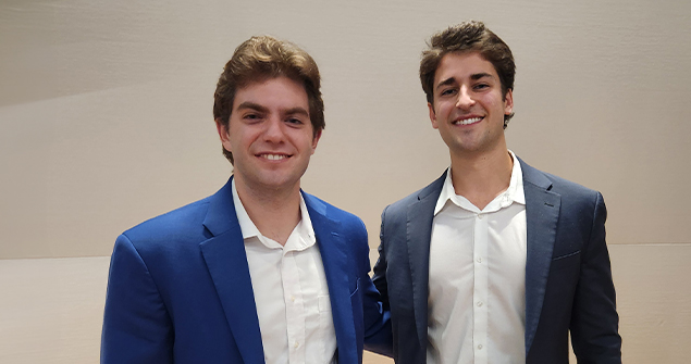 Entrepreneurs, and TCU Neeley students, smiling after a pitch presentation