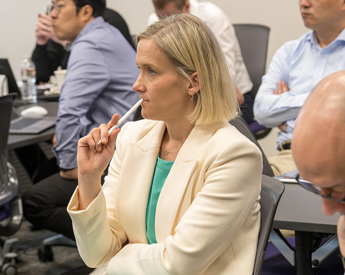 Female Executive Education student learning in class