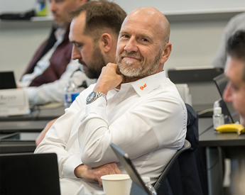 Smiling Executive Education partner in class