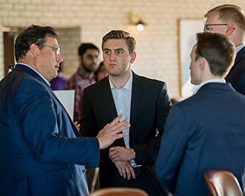 Group having a discussion at the Graduate Case Competition