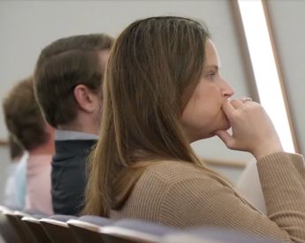 Student attentively listen in auditorium