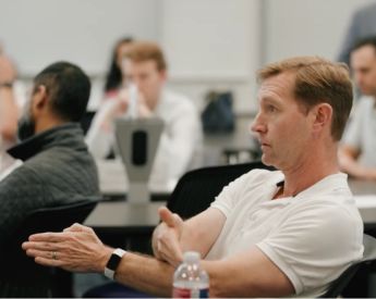 Executive Education participants engaging in class