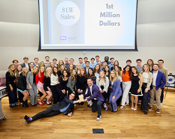TCU Neeley Sales Center students and faculty celebrating a sales win