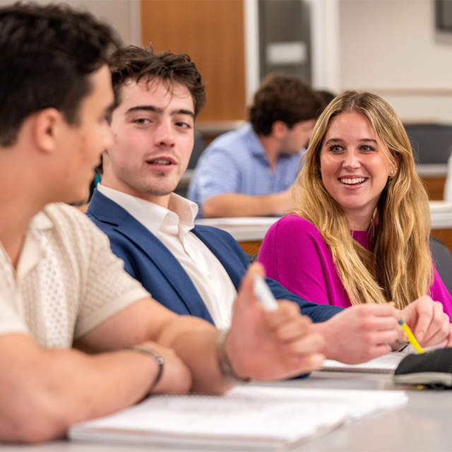 TCU Neeley undergraduate students having a discussion in lecture hall
