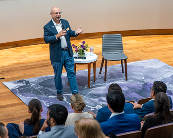 Speaker presenting at AI Forward event