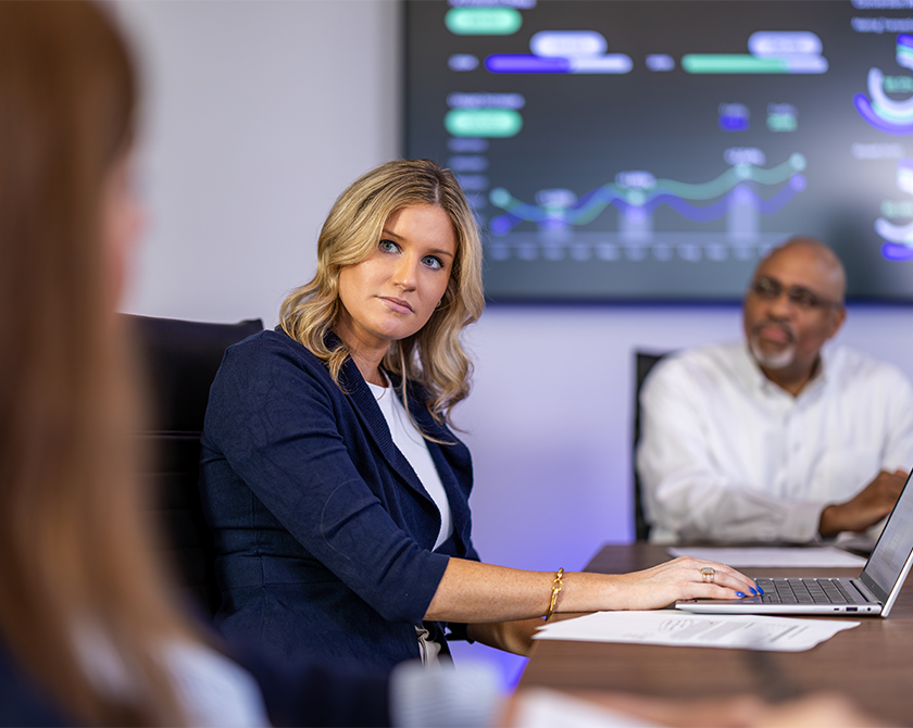 Woman engaged in discussion during a work presentation