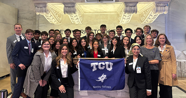Group of Neeley Fellows students posing on a trip to NY Stock Exchange