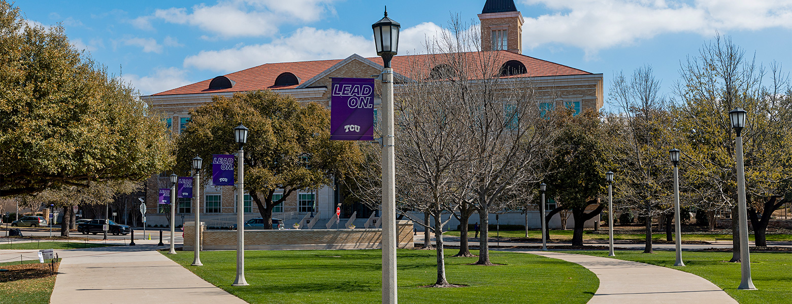 TCU campus sidewalks with Lead On banner