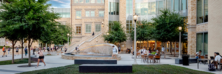TCU Neeley students working, studying and walking to class outside Neeley School of Business