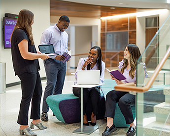TCU graduate students working together in the Neeley School of Business