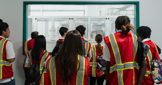 Business Technology Camp students looking through a warehouse window