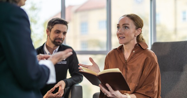 Graduate students and faculty members collaborating