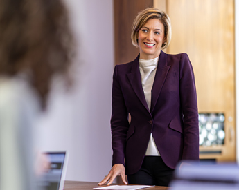 Executive smiling in meeting in Neeley conference room