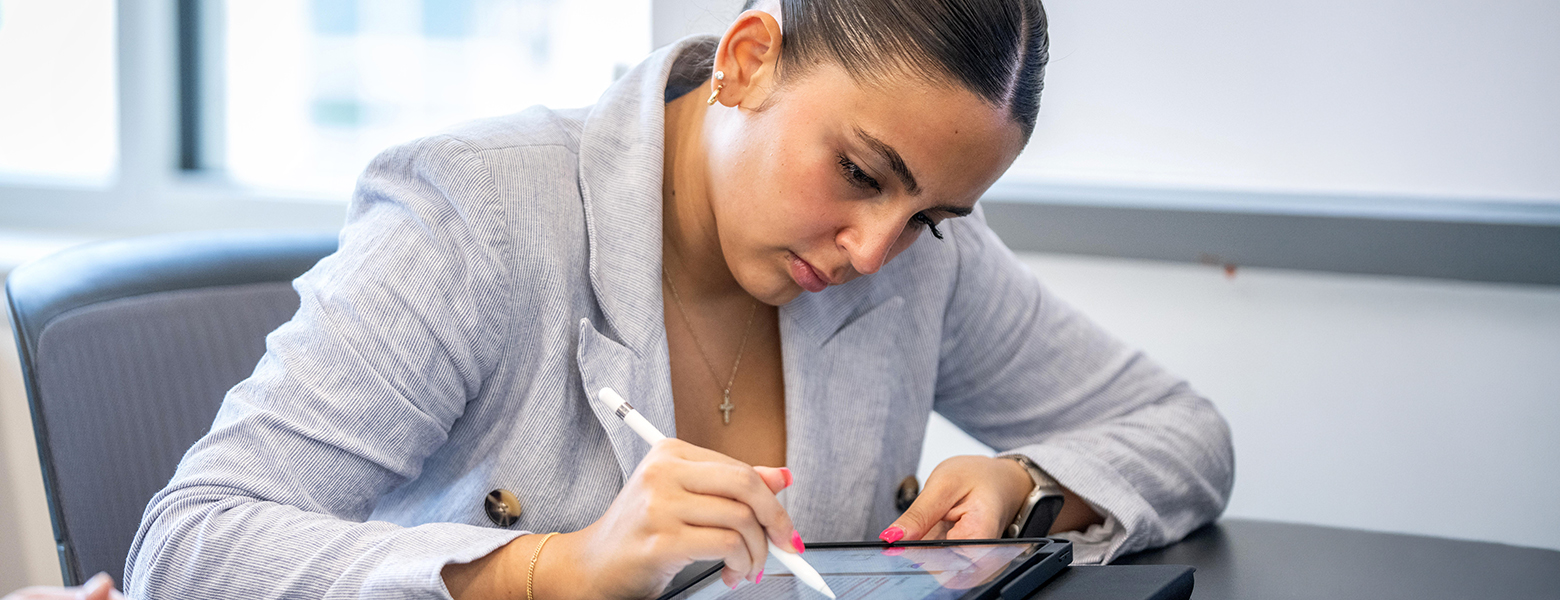 Student taking notes during class