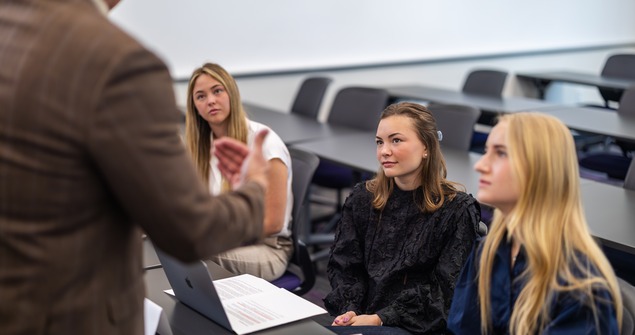 TCU Neeley students listening to pitch in a small group