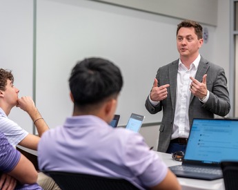 Students paying attention to TCU Neeley professor in class