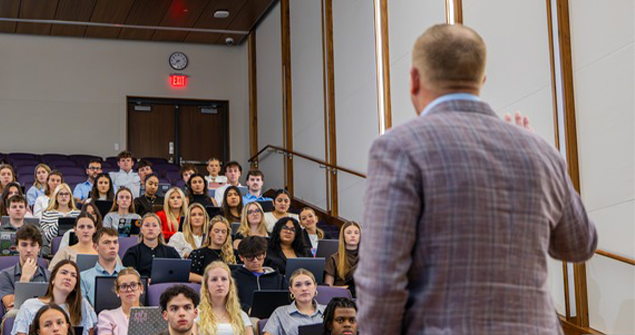 Local business leader presenting as guest speaker in class