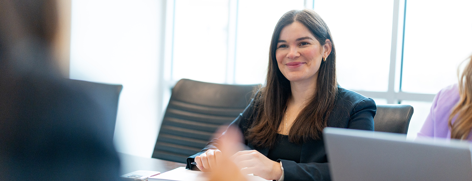 MBA student smiling in meeting