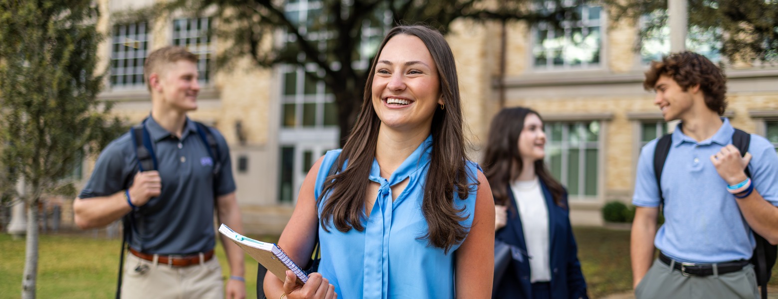 Students talking and walking to class on campus