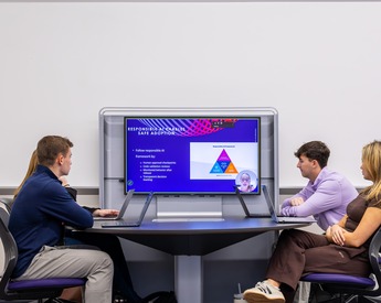Students listening to presentation on how to use AI responsibly as a business advantage