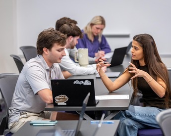 Students pitching across the table