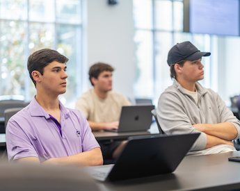 Students listening to presentation on how to use AI responsibly as a business advantage