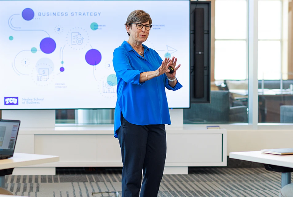 Suzanne Carter explains business strategy to a class of Executive MBA students