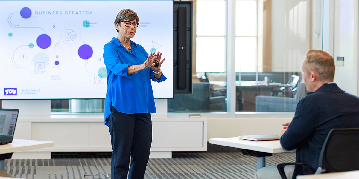 Suzanne Carter explains business strategy to a class of Executive MBA students