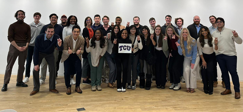 Grad student group with TCU sign