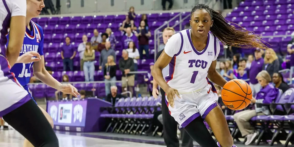 Tomi Taiwo works towards the paint during a TCU-Kansas basketball game