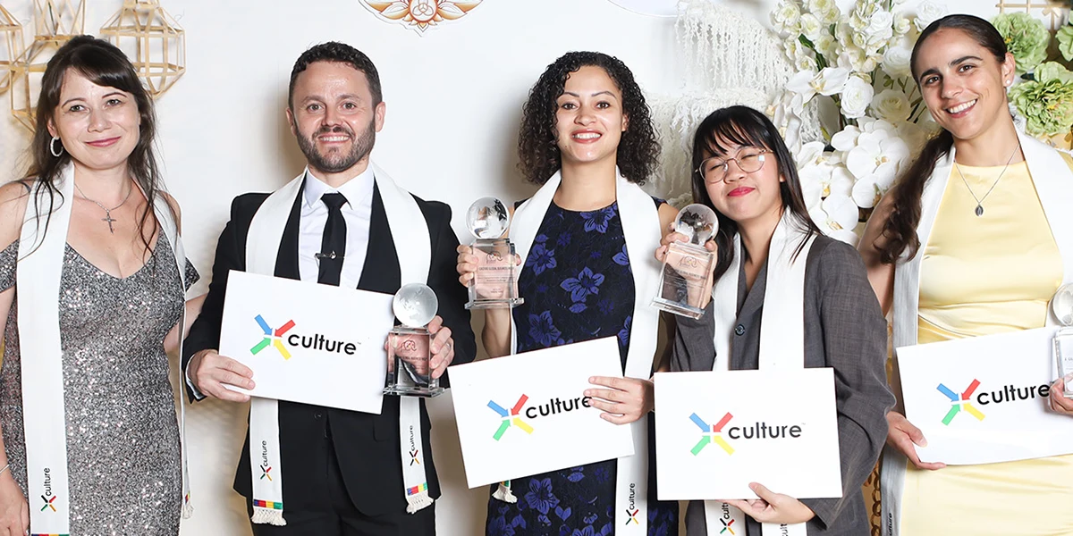 X Culture award winners display their trophies